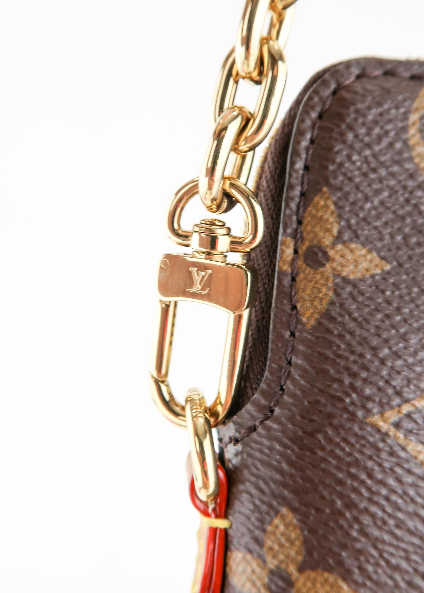 How long is the gold chain on the louis vuitton utility phone