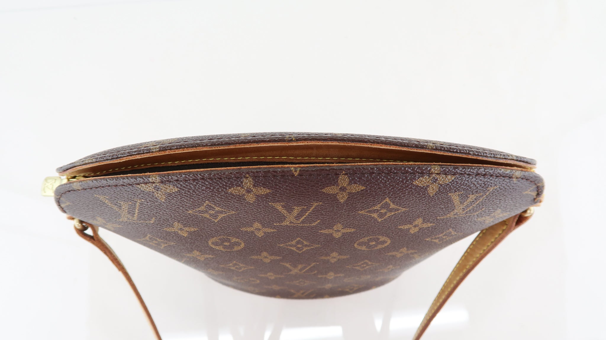 Louis Vuitton Toupie Monogram Brown in Coated Canvas with Gold
